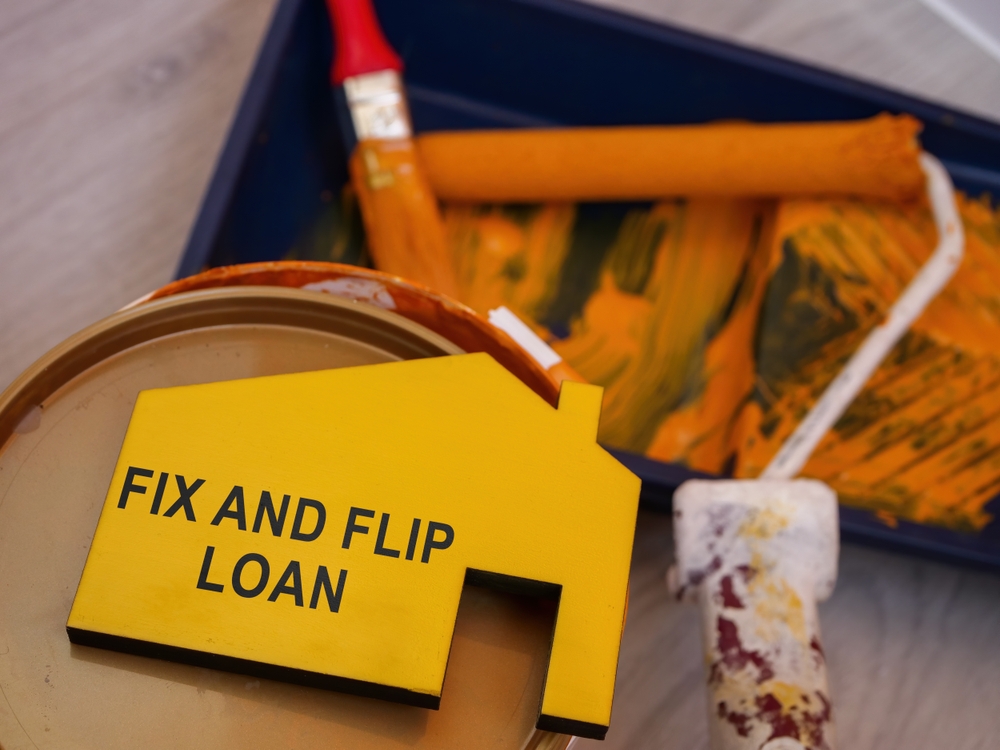 Fix,and,flip,loan,inscription,,can,of,paint,and,brush.